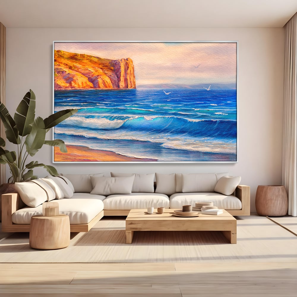 Tablou canvas cu pictura cu stanca pe malul marii, in rama de aluminiu argintiu, pe perete intr-un living